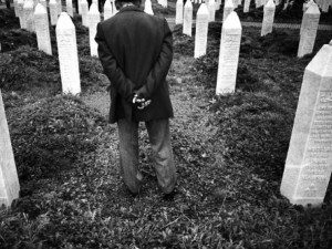 Bosnian man in cemetery (Damir Sagolj/Reuters)